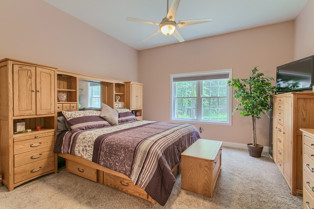 264 Westford Road Tyngsborough, MA 01879 - Photo 8 of 27 a bed room with a bed and a window