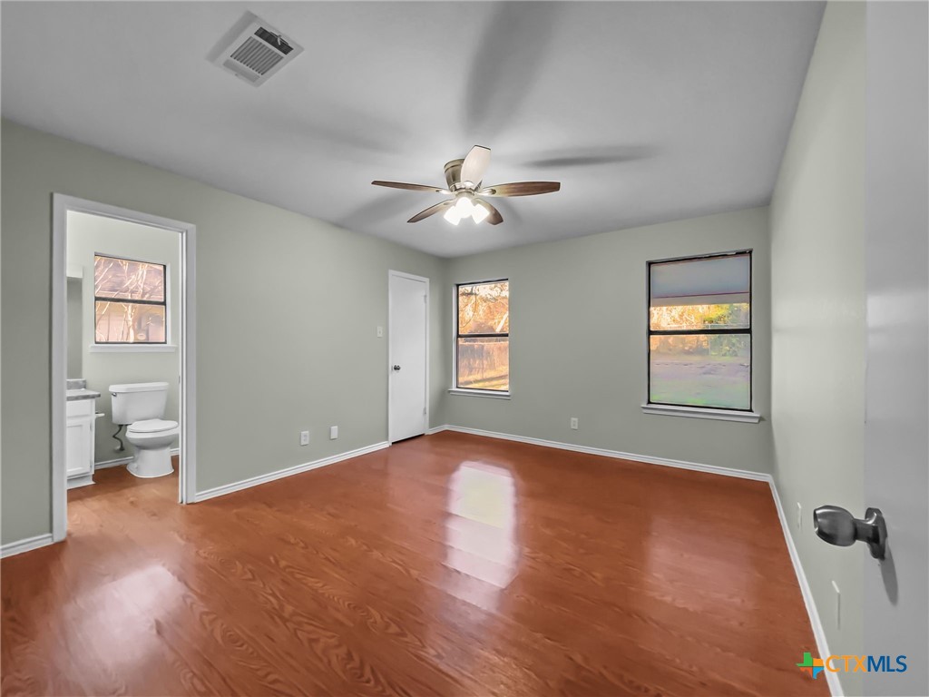 5009 Ridge Haven Drive Killeen, TX 76543 - Photo 11 of 16 wooden floor in an empty room with a window