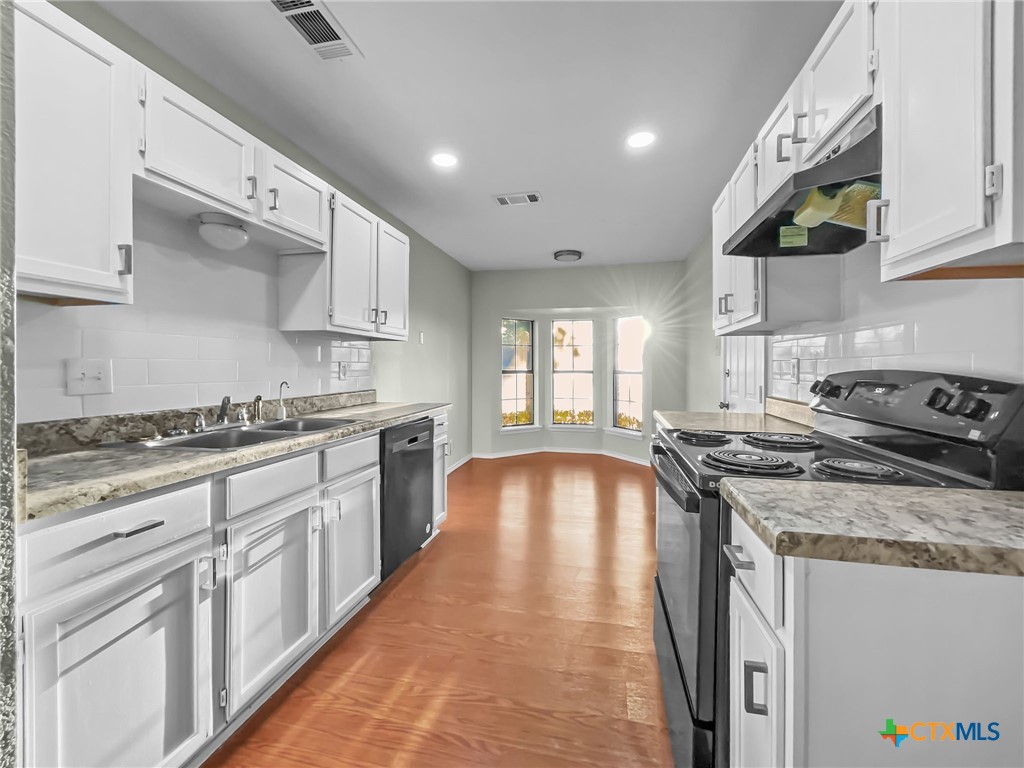 5009 Ridge Haven Drive Killeen, TX 76543 - Photo 4 of 16 a kitchen with stainless steel appliances granite countertop a stove a sink and a granite counter tops