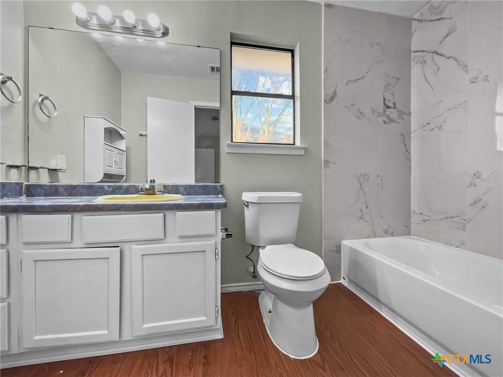 5009 Ridge Haven Drive Killeen, TX 76543 - Photo 10 of 16 a bathroom with a sink a toilet and shower