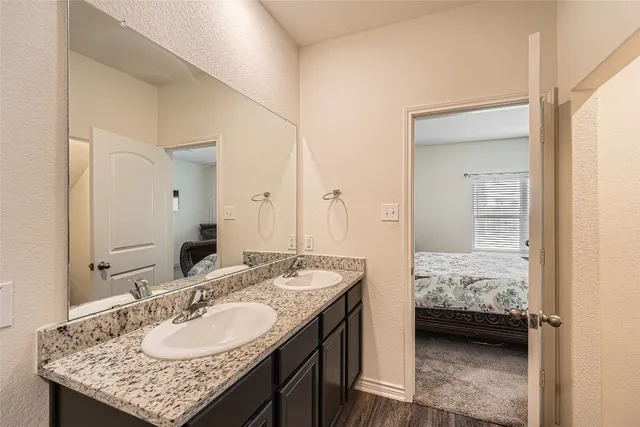 a en suite bathroom with sink granite