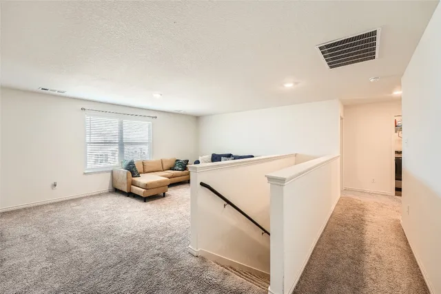 a view of livingroom with furniture and window