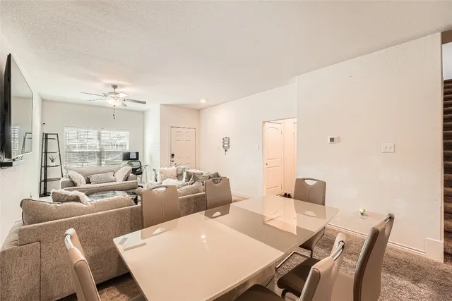 a large living room with furniture