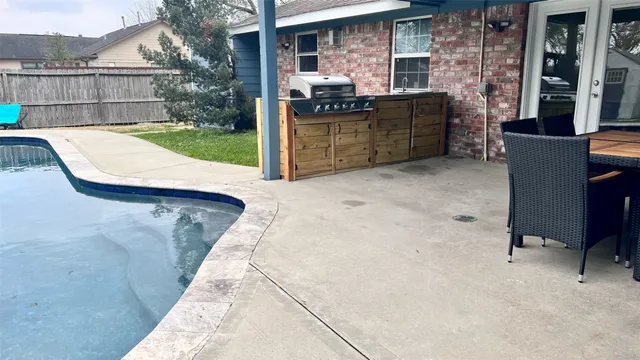 a view of backyard with outdoor seating