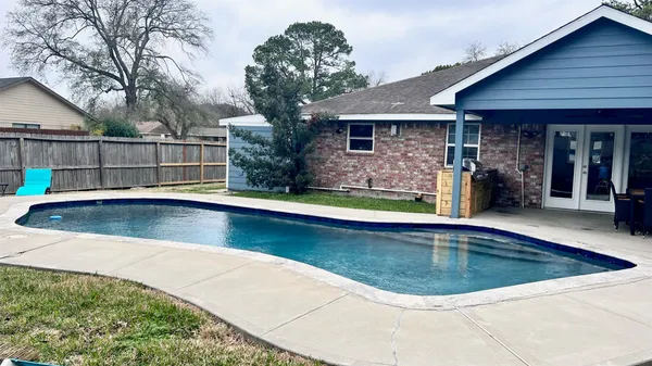 a view of a house with swimming pool