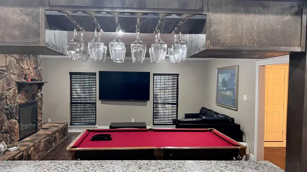 a view of gym equipment with kitchen view