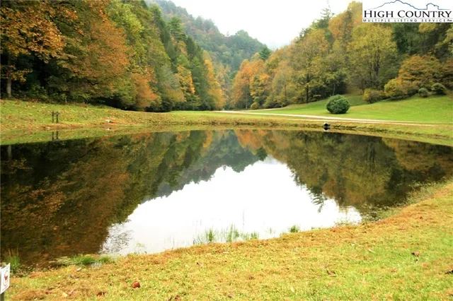 a view of a lake with a yard