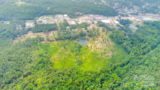 a view of a small house with a yard