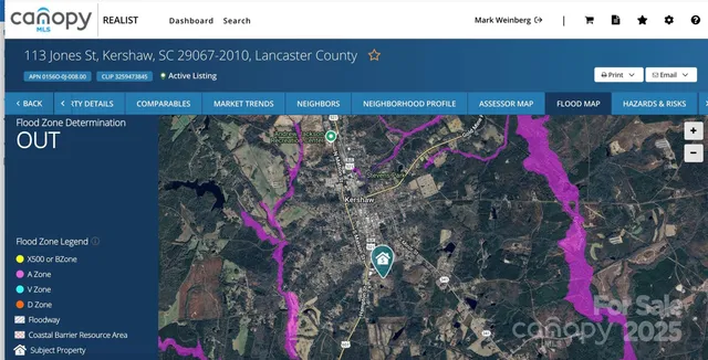a view of a green yard with an trees