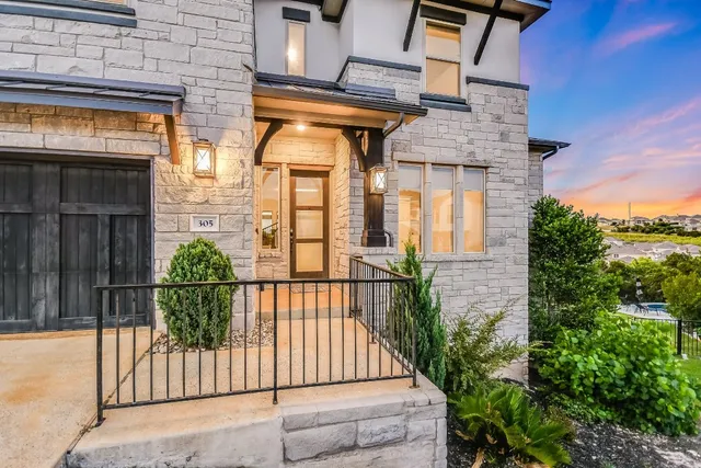 a view of a brick house with a large windows