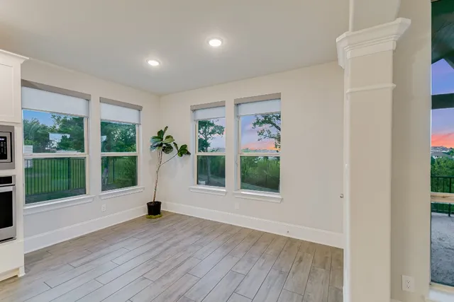 a view of an entryway with wooden floor