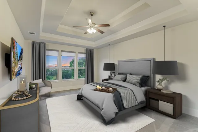 a spacious bedroom with a bed and a flat tv screen