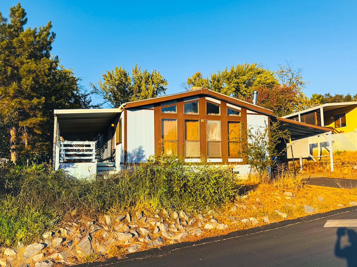 314 South Main Street, Unit 187 Angels Camp, CA 95222 - Photo 2 of 27 a front view of a house with a yard