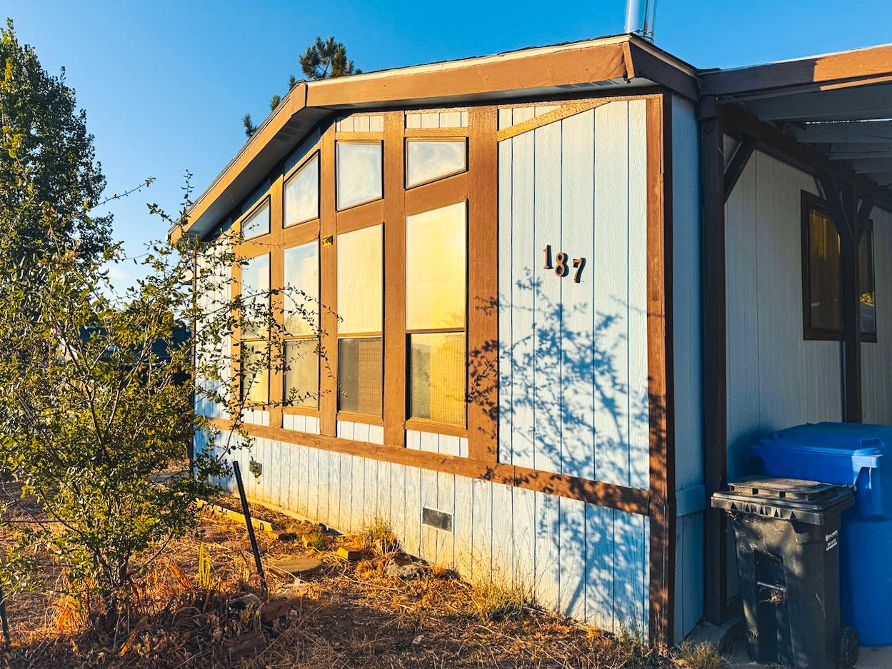 314 South Main Street, Unit 187 Angels Camp, CA 95222 - Photo 25 of 27 a front view of a house with a yard