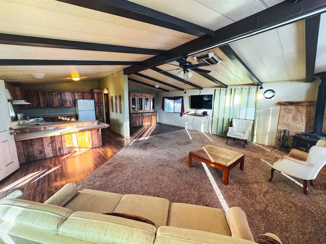 a living room with furniture and a rug