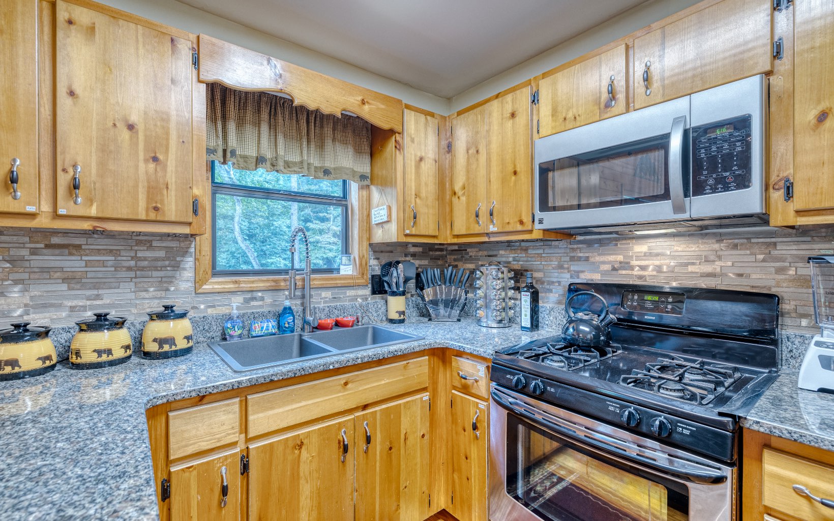 271 Rolling Hill Morganton, GA 30560 - Photo 20 of 69 a kitchen with stainless steel appliances granite countertop a stove a sink and a microwave