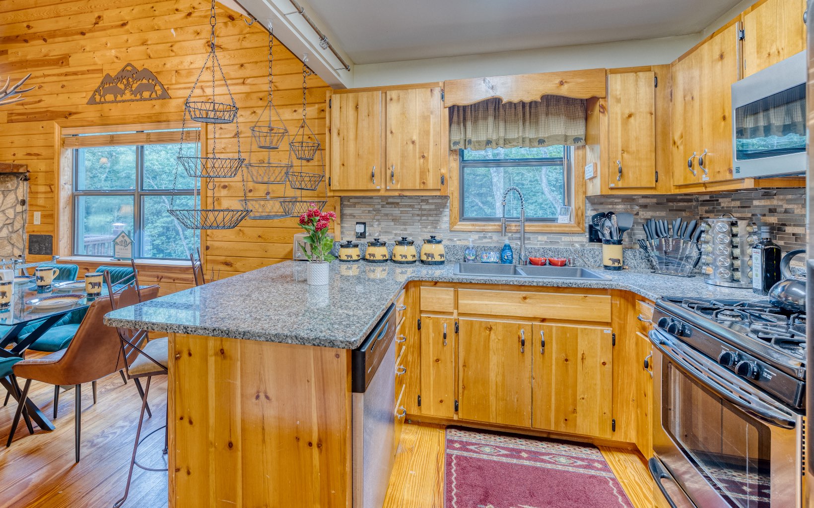 271 Rolling Hill Morganton, GA 30560 - Photo 21 of 69 a kitchen with a sink a stove and wooden cabinets