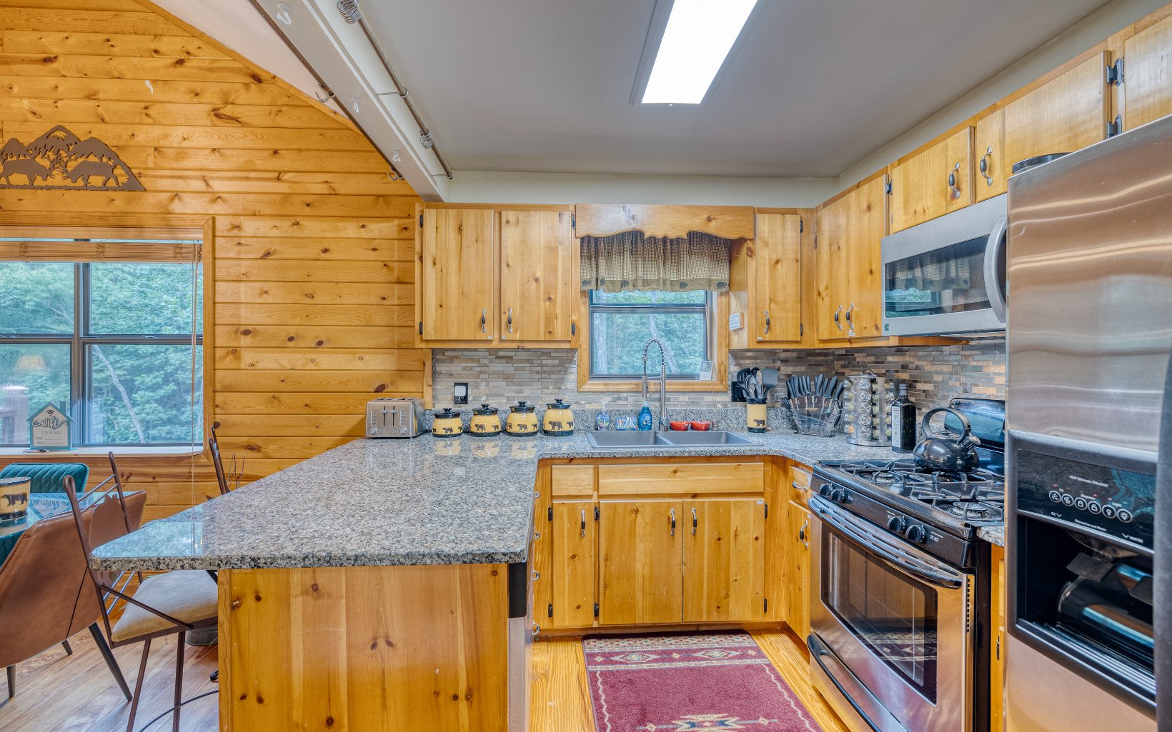271 Rolling Hill Morganton, GA 30560 - Photo 22 of 69 a kitchen with a sink a stove and cabinets