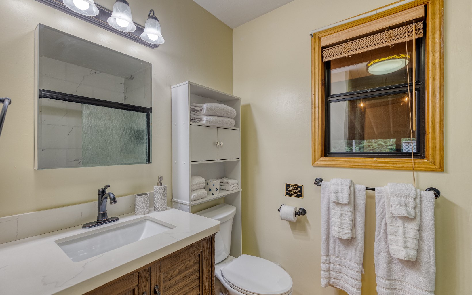 271 Rolling Hill Morganton, GA 30560 - Photo 34 of 69 a bathroom with a sink vanity mirror and toilet