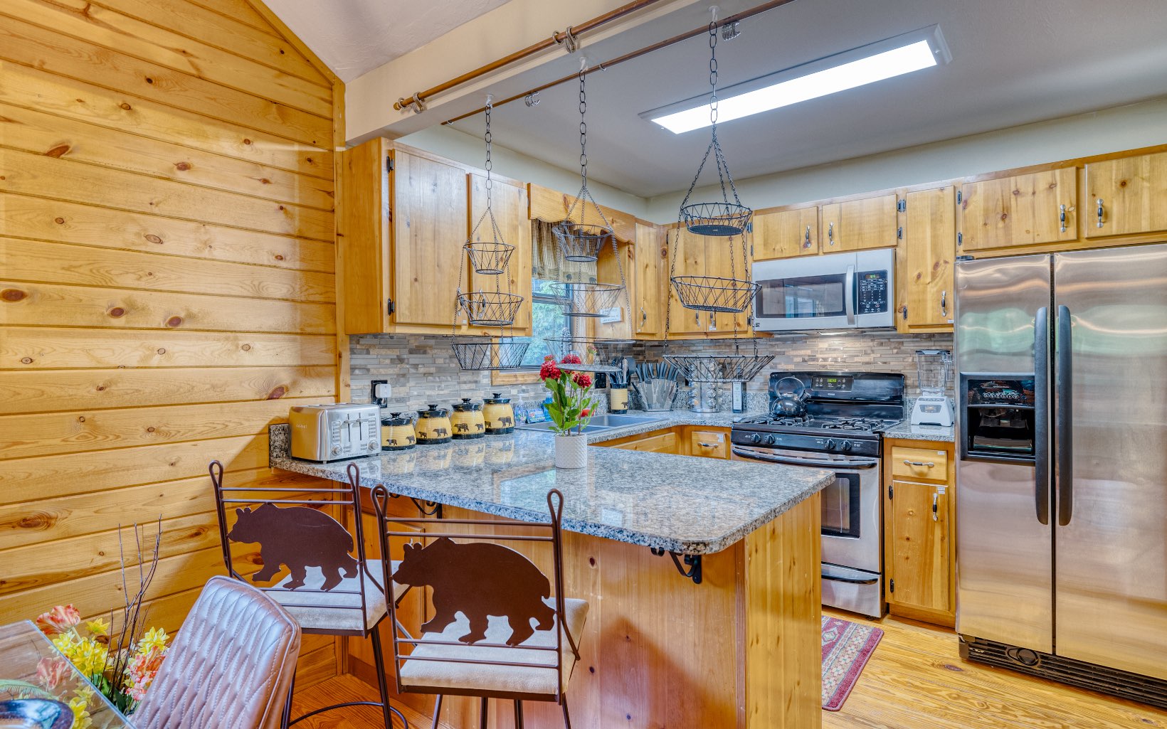 271 Rolling Hill Morganton, GA 30560 - Photo 4 of 69 a kitchen with stainless steel appliances granite countertop a sink and wooden cabinets