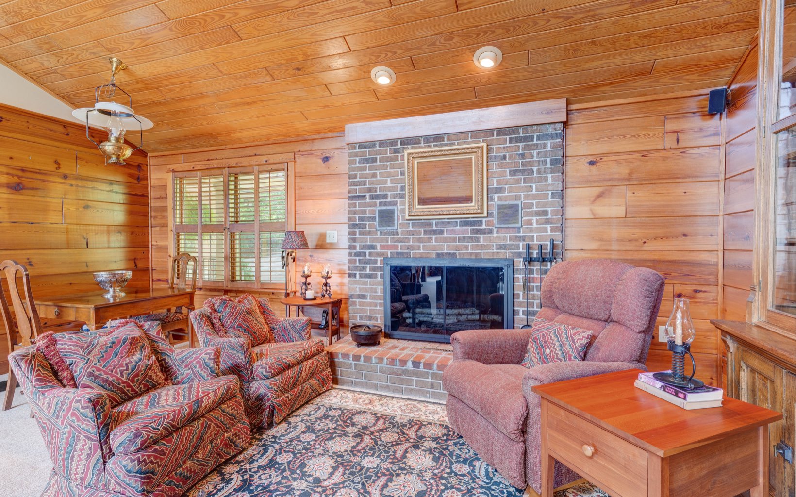 360 Apache Trail Chatsworth, GA 30705 - Photo 14 of 41 a living room with furniture and a fireplace