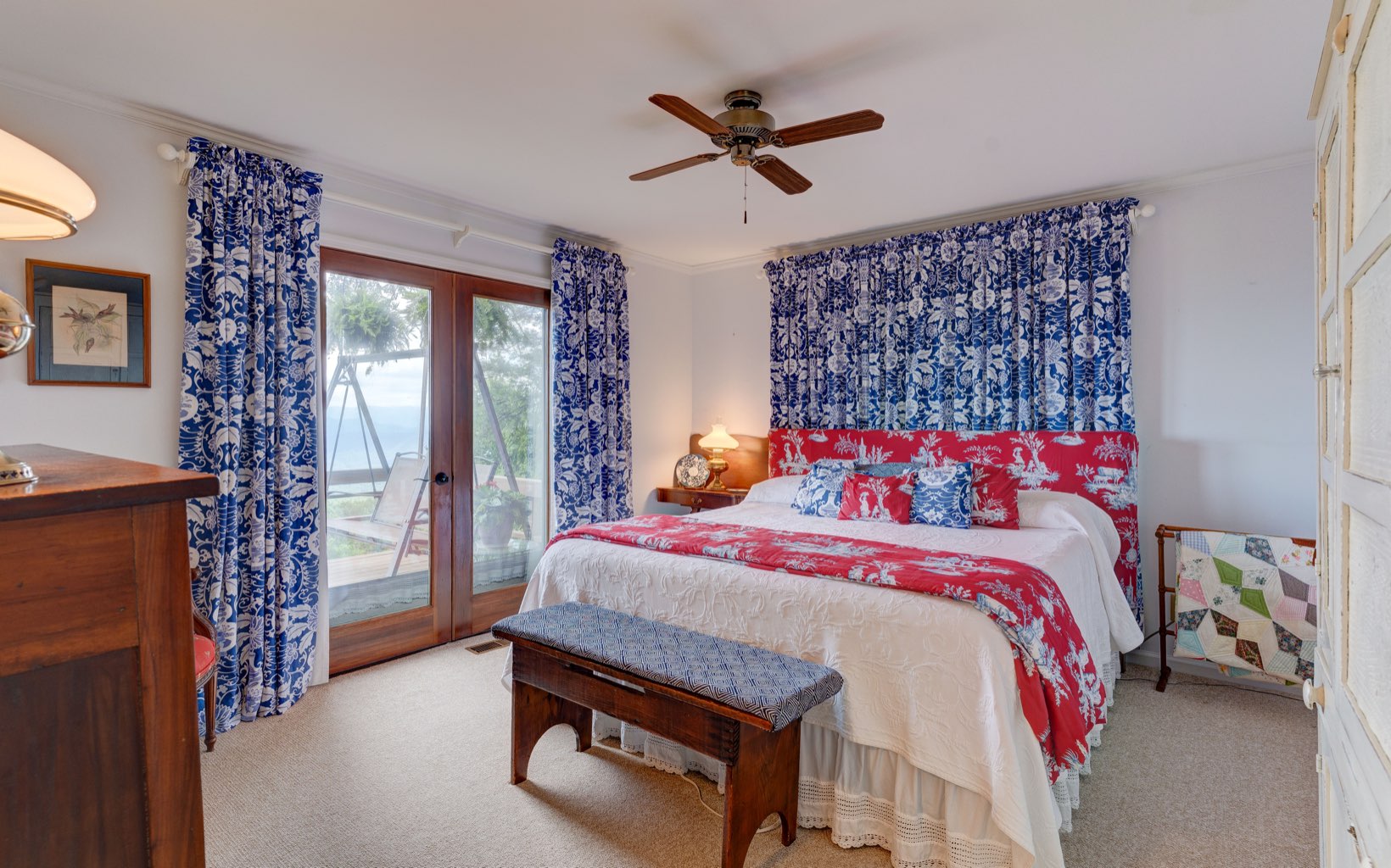 360 Apache Trail Chatsworth, GA 30705 - Photo 17 of 41 a bedroom with a bed and a chandelier