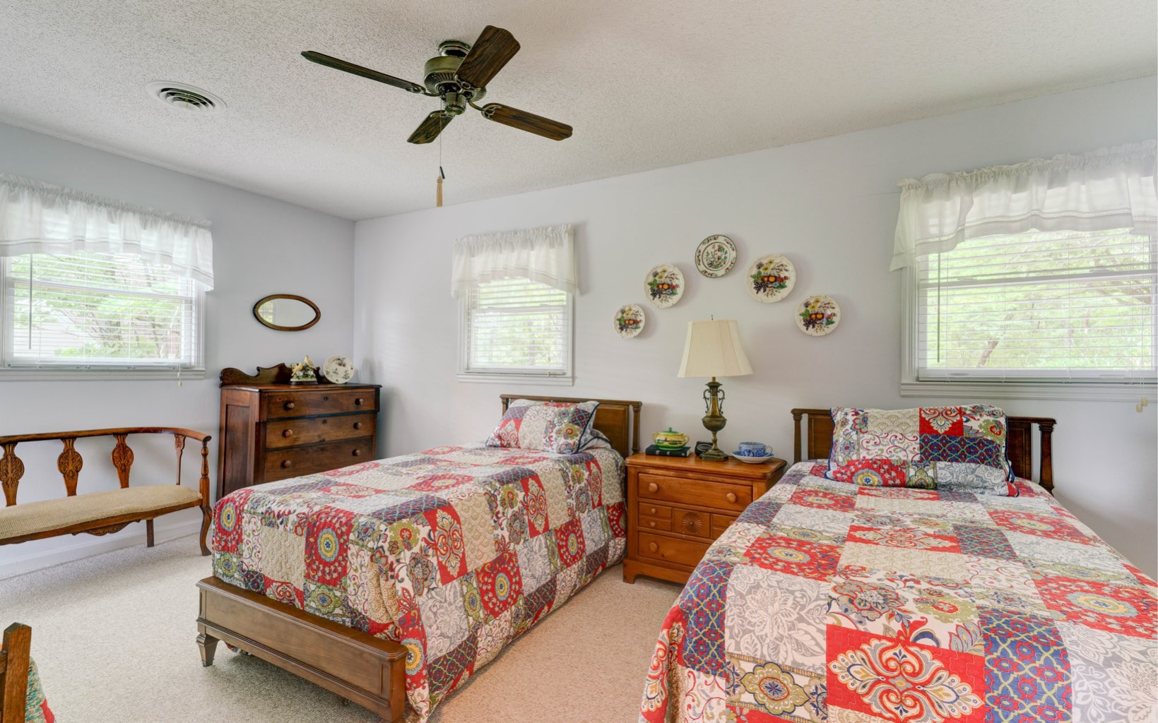 360 Apache Trail Chatsworth, GA 30705 - Photo 23 of 41 a bedroom with two beds and a chandelier