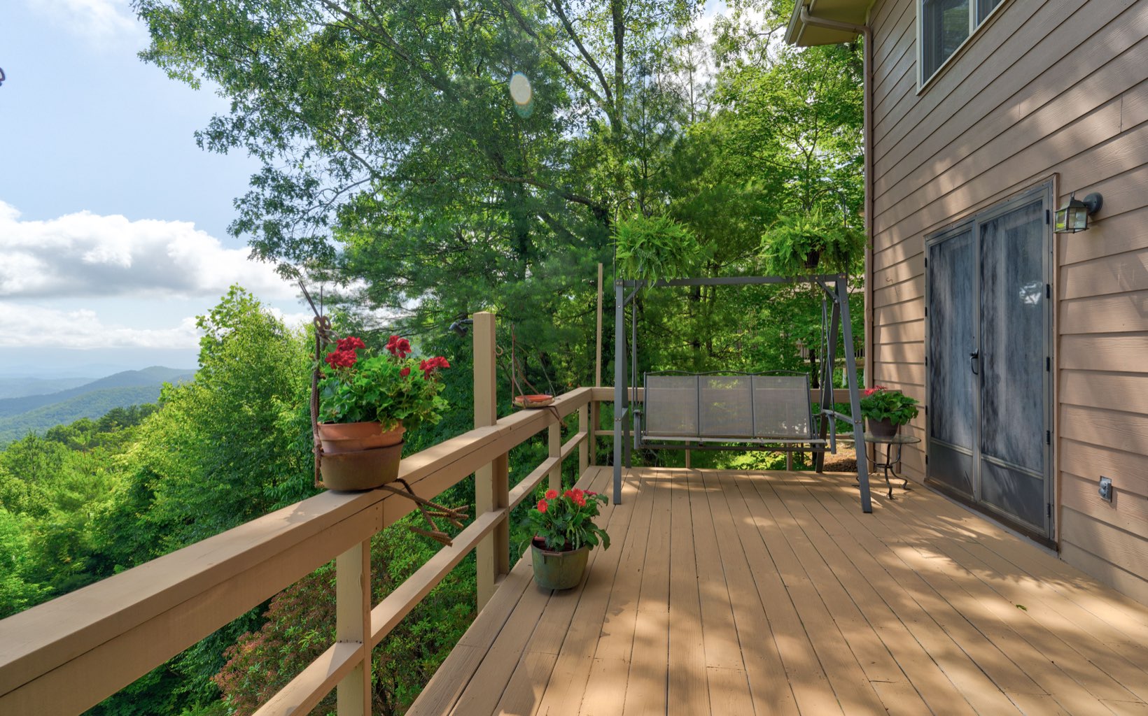 360 Apache Trail Chatsworth, GA 30705 - Photo 35 of 41 a view of balcony with wooden floor and outdoor seating