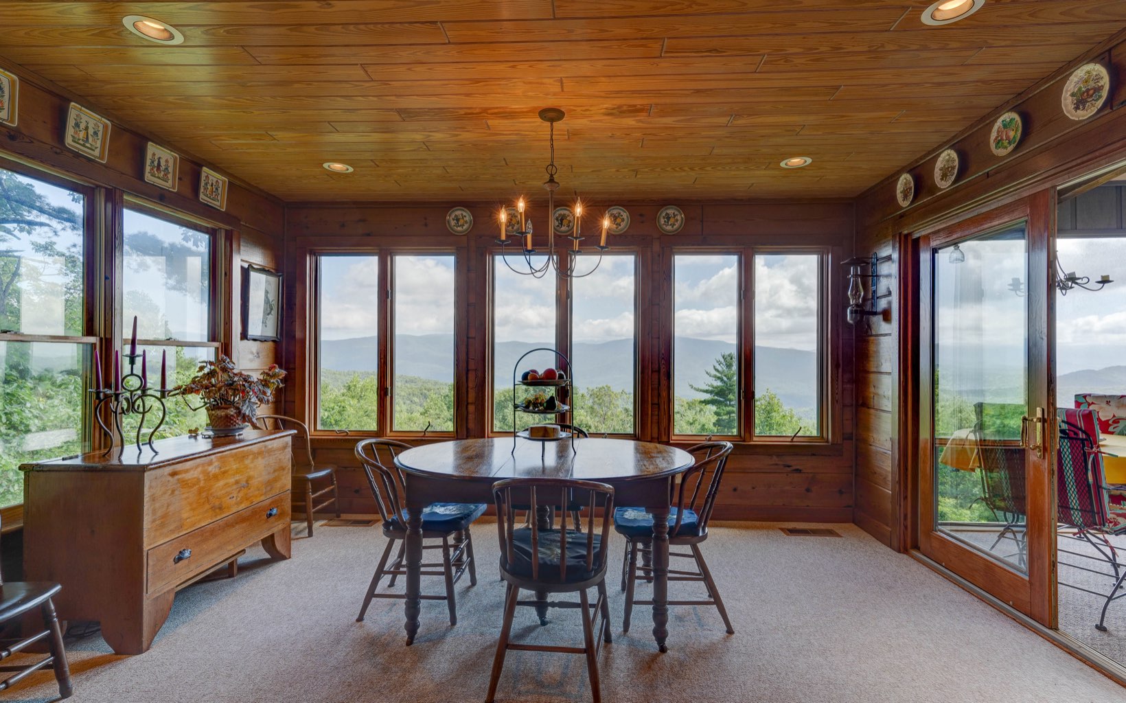360 Apache Trail Chatsworth, GA 30705 - Photo 5 of 41 a view of a dining room with furniture large windows and wooden floor