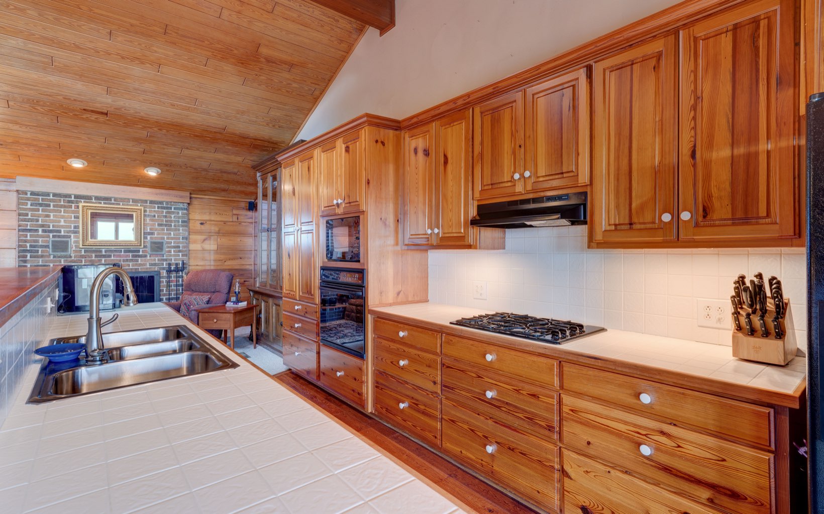360 Apache Trail Chatsworth, GA 30705 - Photo 8 of 41 a kitchen with granite countertop a stove and cabinets