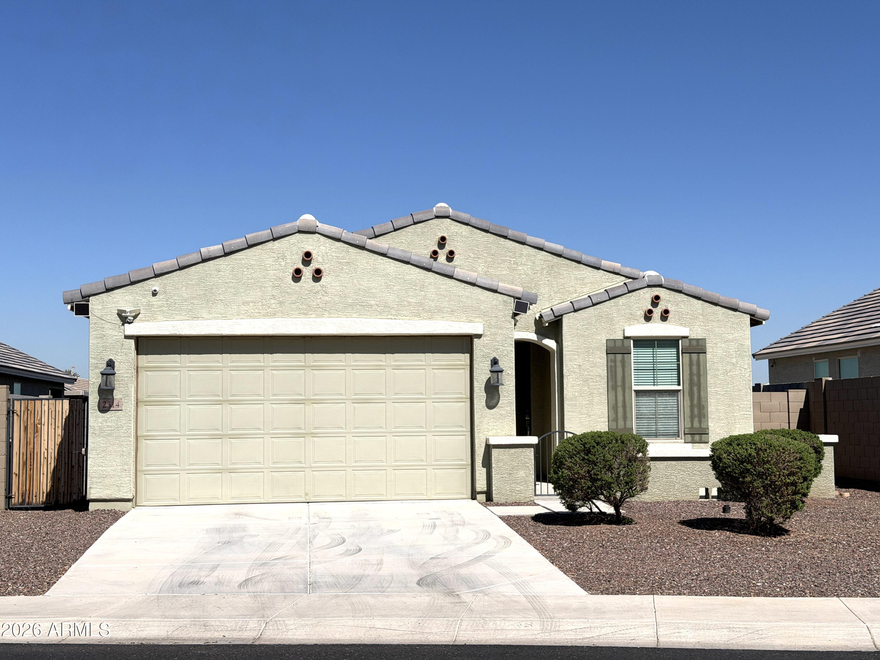 2314 East Harwell Road Phoenix, AZ 85042 - Photo 1 of 32 a front view of a house with a yard