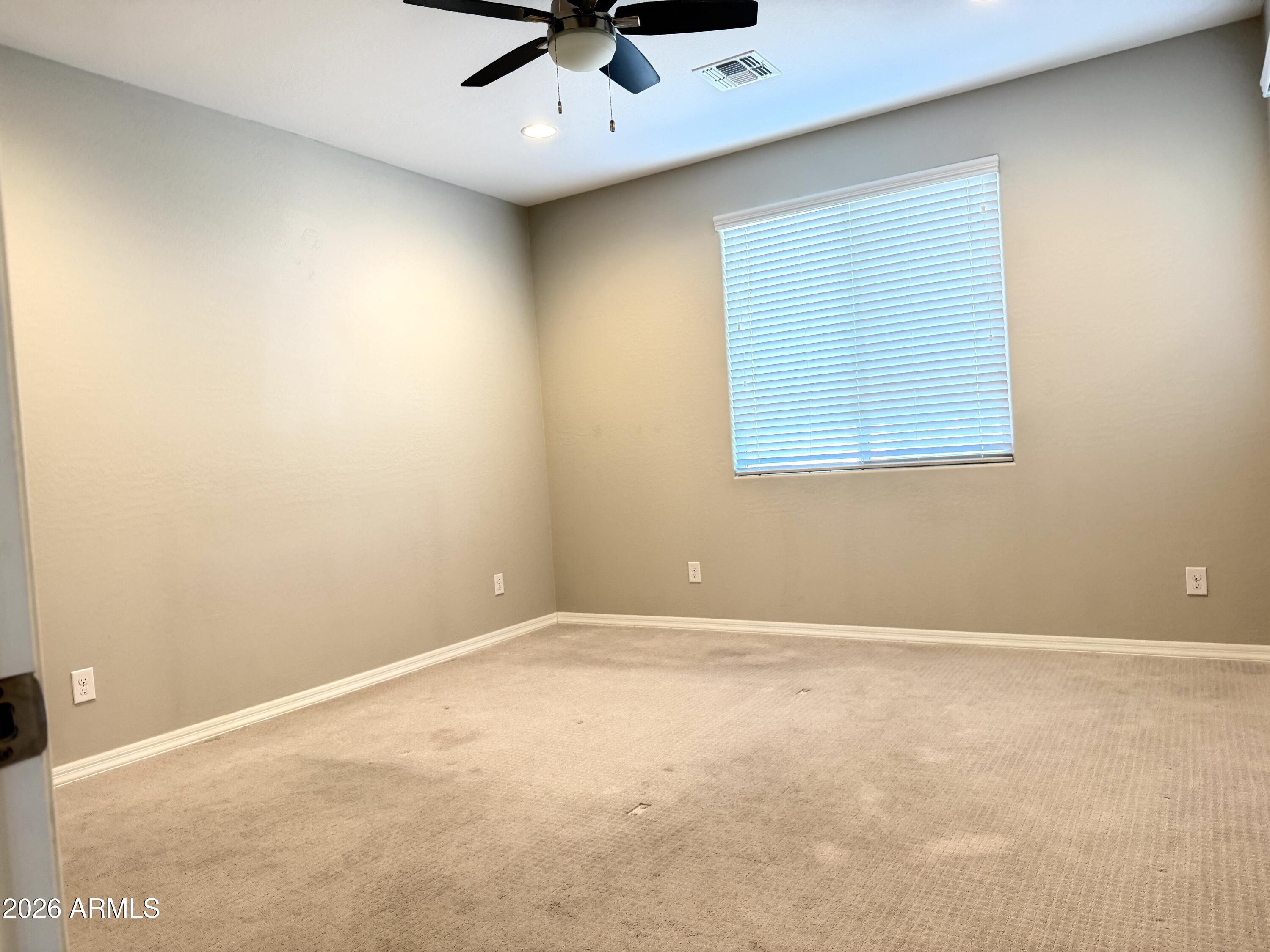 2314 East Harwell Road Phoenix, AZ 85042 - Photo 14 of 32 an empty room with a window