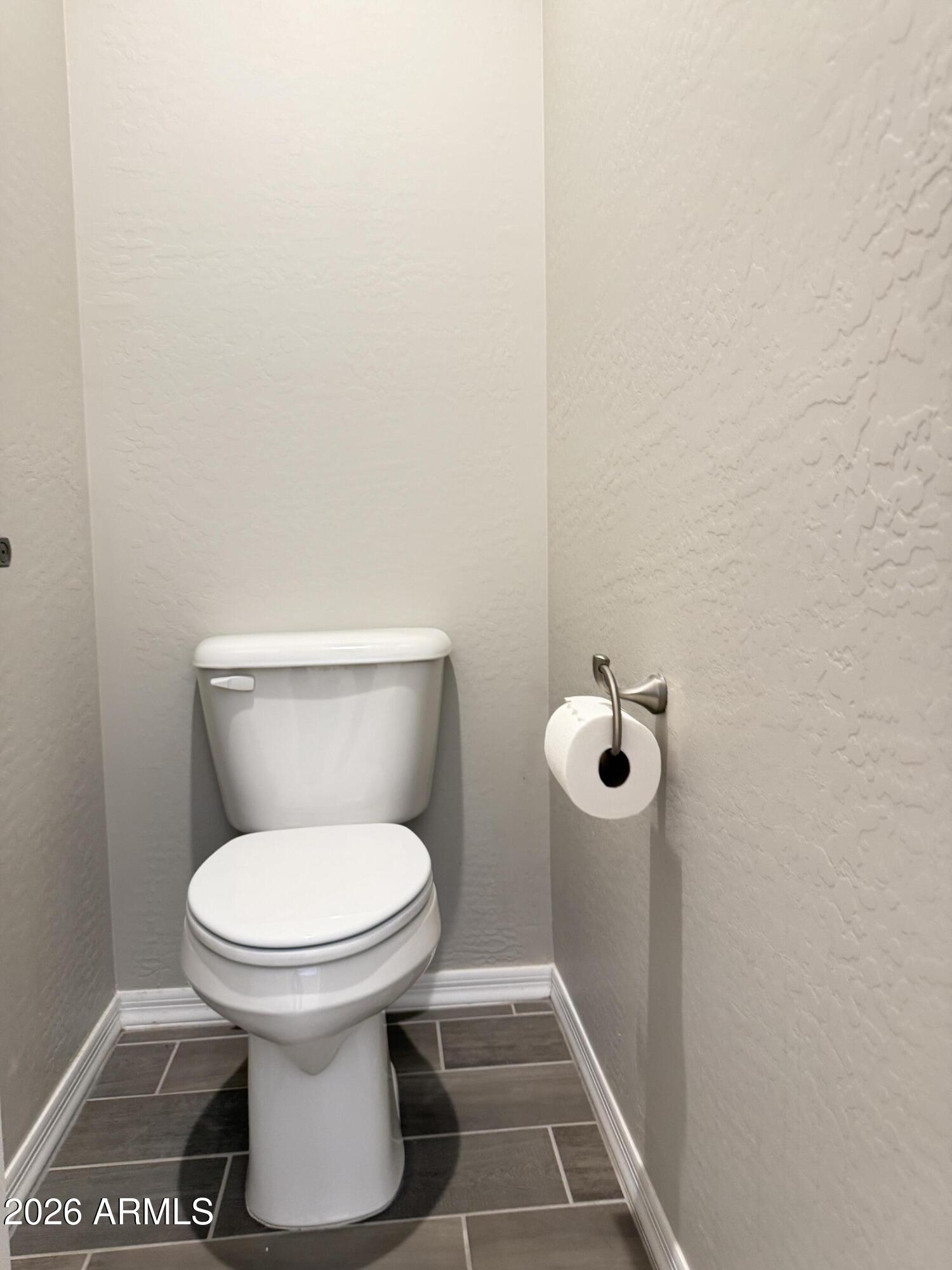 2314 East Harwell Road Phoenix, AZ 85042 - Photo 17 of 32 a bathroom with a toilet and a shower