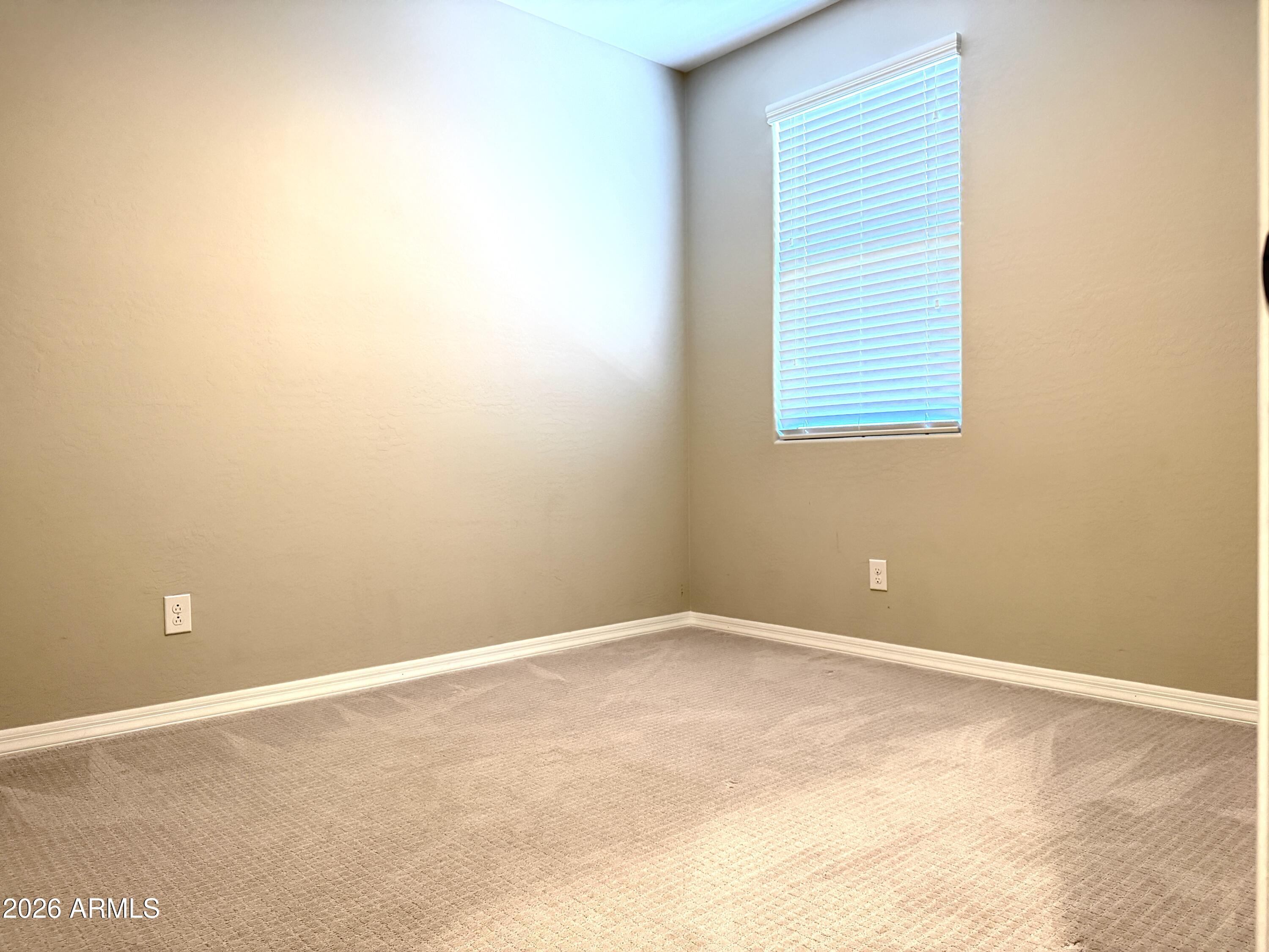 2314 East Harwell Road Phoenix, AZ 85042 - Photo 19 of 32 a view of an empty room with a window