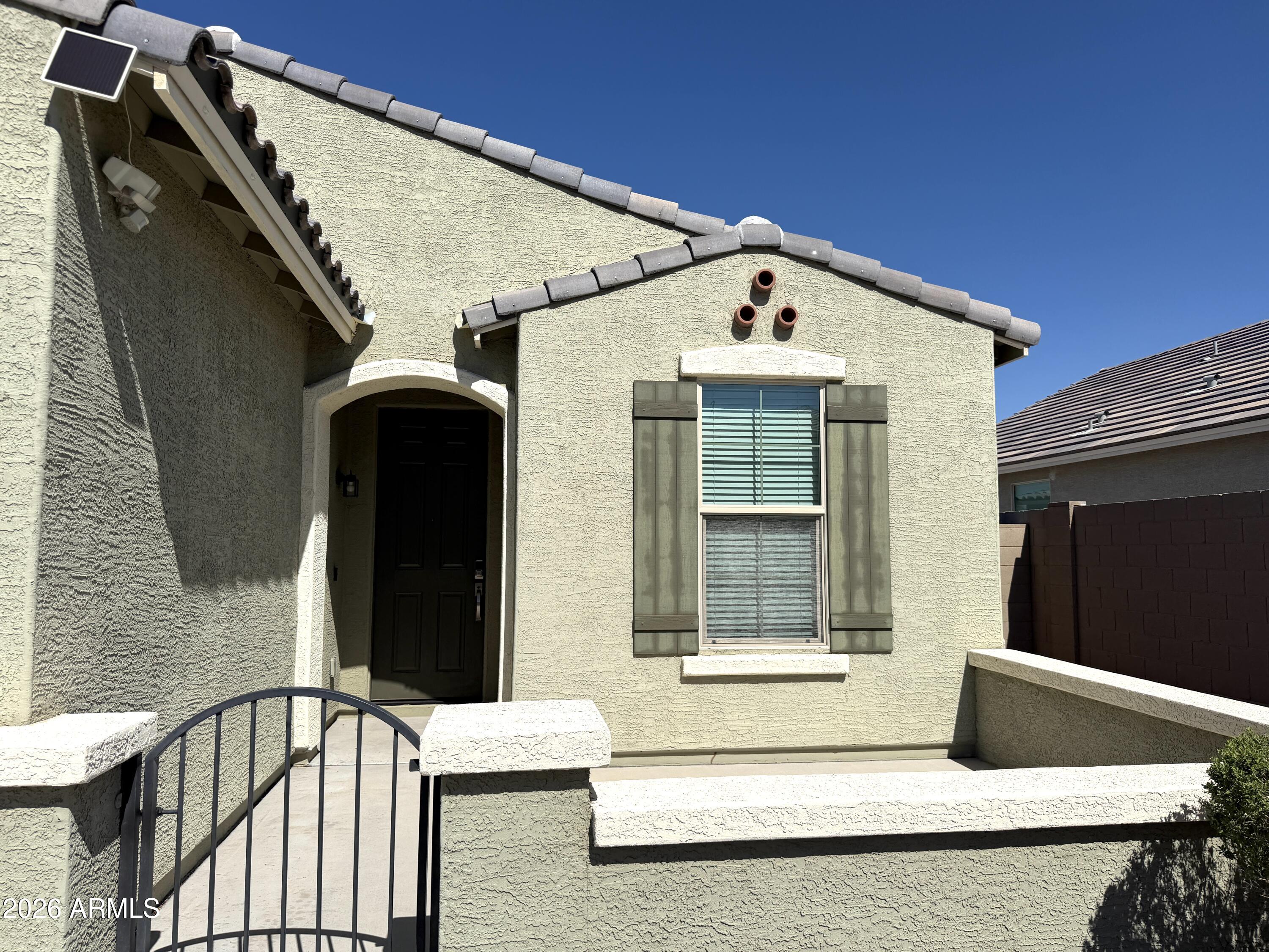 2314 East Harwell Road Phoenix, AZ 85042 - Photo 2 of 32 a front view of a house with a window