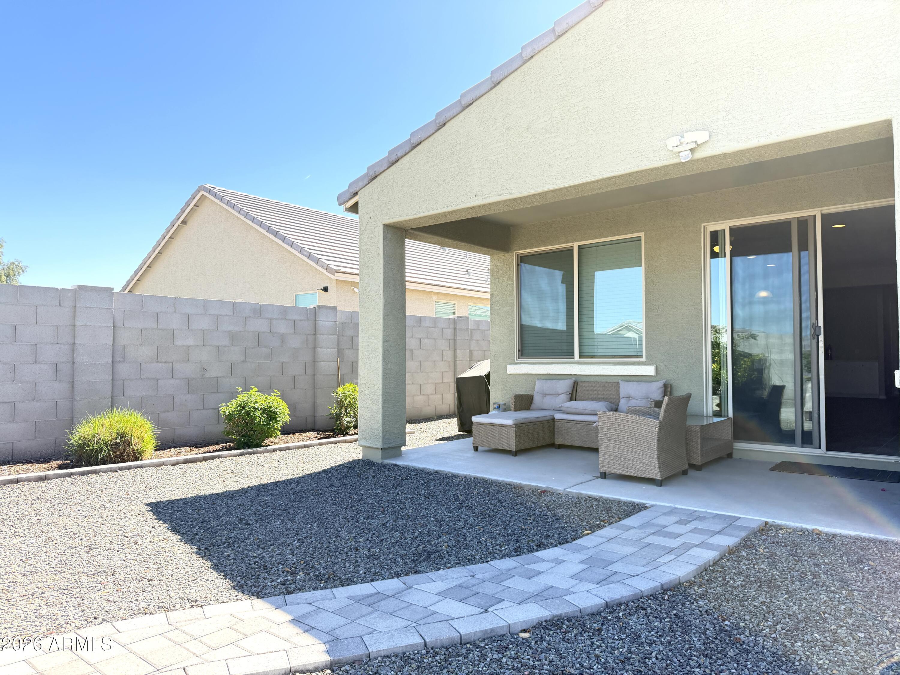 2314 East Harwell Road Phoenix, AZ 85042 - Photo 27 of 32 a living room with furniture and a potted plant