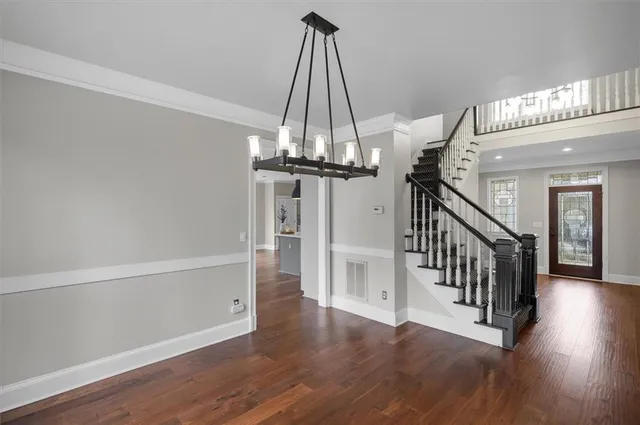 a kitchen with stainless steel appliances a sink stove and refrigerator
