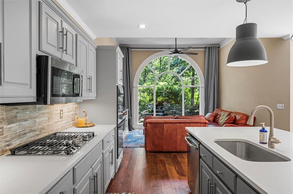 130 Belvedere Court Atlanta, GA 30350 - Photo 16 of 59 a kitchen with stainless steel appliances granite countertop a sink stove and cabinets