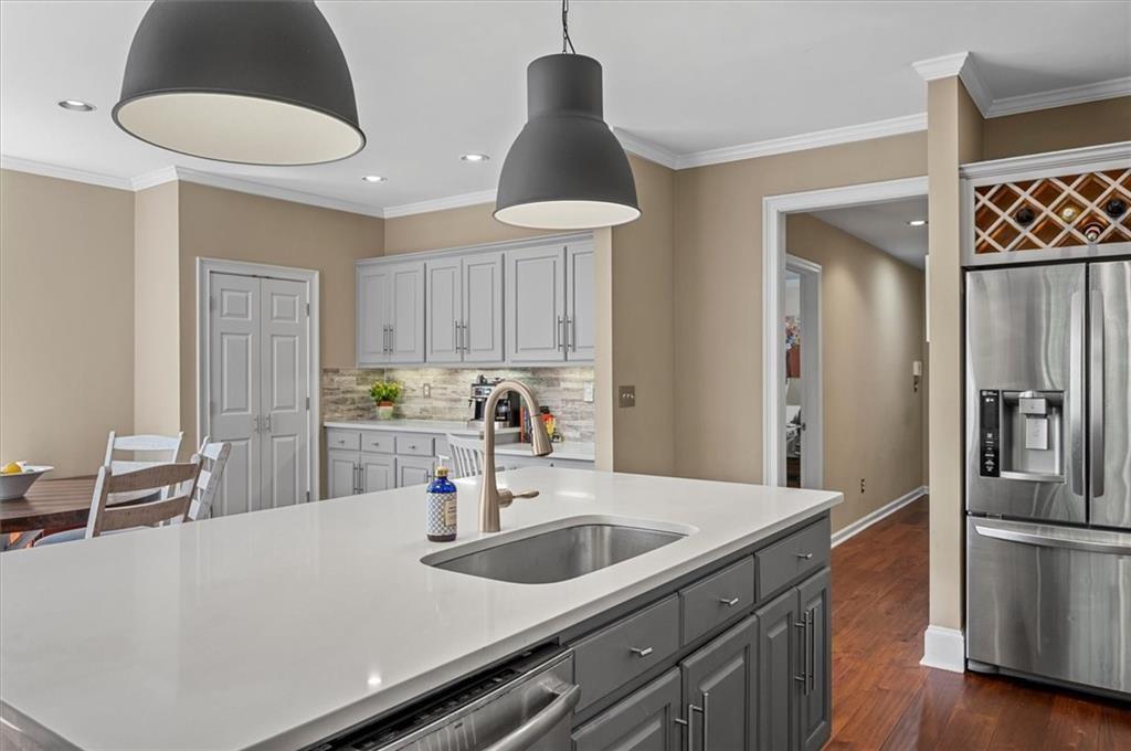 130 Belvedere Court Atlanta, GA 30350 - Photo 20 of 59 a kitchen with stainless steel appliances a sink a stove and refrigerator