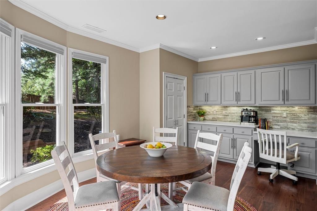 130 Belvedere Court Atlanta, GA 30350 - Photo 23 of 59 a kitchen with a table chairs and wooden floor
