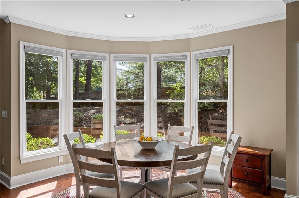 130 Belvedere Court Atlanta, GA 30350 - Photo 24 of 59 a dining room with furniture window and wooden floor