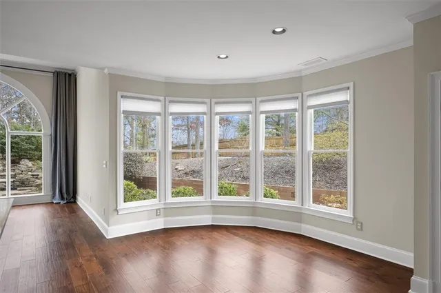 a kitchen with a refrigerator sink and white cabinets