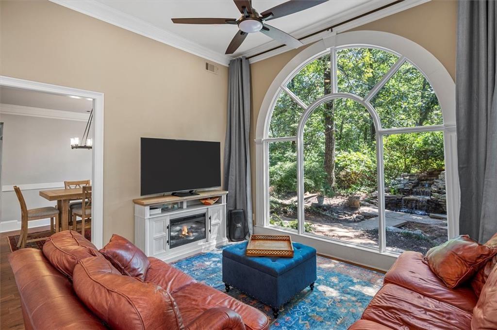 130 Belvedere Court Atlanta, GA 30350 - Photo 25 of 59 a living room with furniture a flat screen tv and a large window