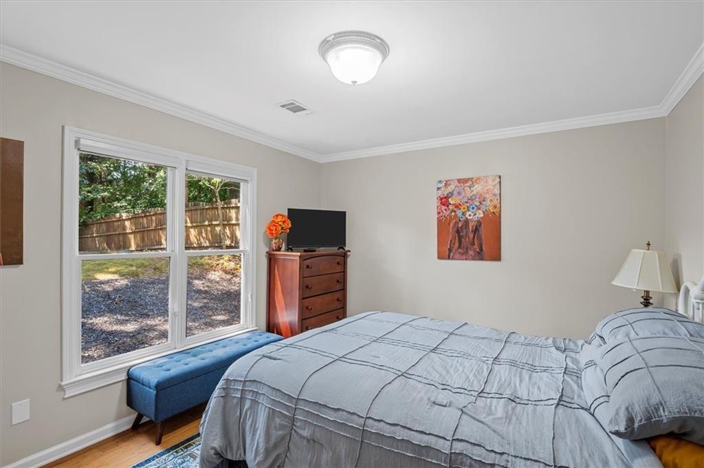 130 Belvedere Court Atlanta, GA 30350 - Photo 29 of 59 a bedroom with a bed and a tv