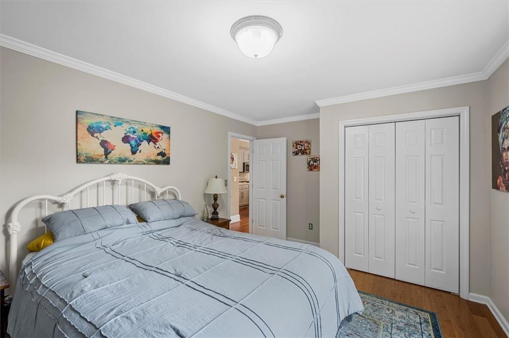 130 Belvedere Court Atlanta, GA 30350 - Photo 30 of 59 a bedroom with a bed and a painting on the wall