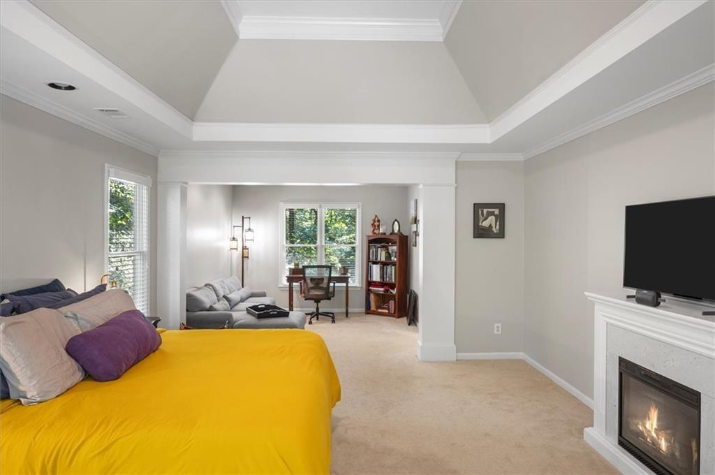 130 Belvedere Court Atlanta, GA 30350 - Photo 35 of 59 a bed room with a bed and flat screen tv