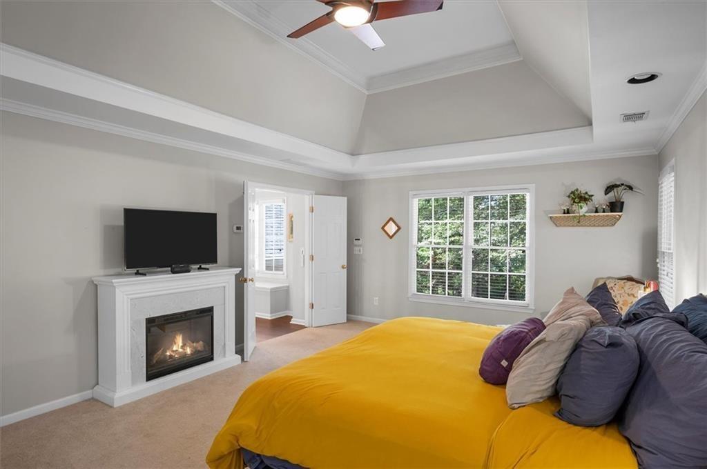 130 Belvedere Court Atlanta, GA 30350 - Photo 37 of 59 a bedroom with a bed and a fireplace