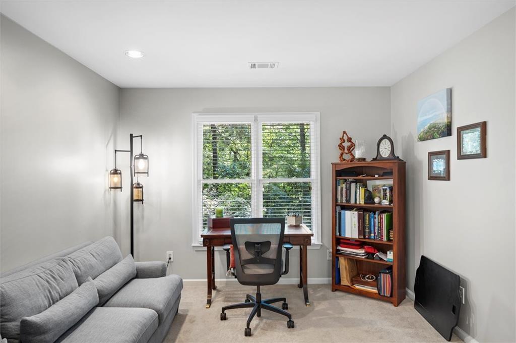 130 Belvedere Court Atlanta, GA 30350 - Photo 38 of 59 a work room with furniture and a book shelf
