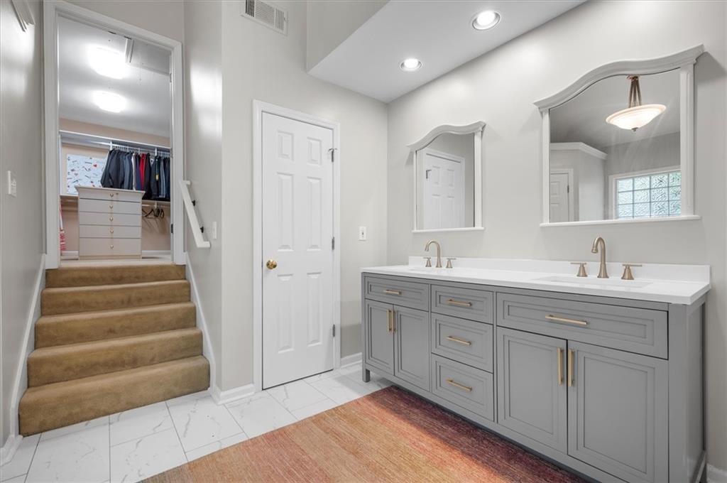 130 Belvedere Court Atlanta, GA 30350 - Photo 42 of 59 a spacious bathroom with a double vanity sink and a mirror