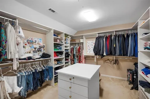 a bathroom with a sink double vanity and a mirror
